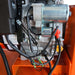 Engine wiring and starter motor connections on ATV/UTV Tow Behind Flail Mower.