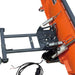 Close-up of the TMG-ATS60 snow plow showing the electric actuator, return springs, angle-adjustment plate and wiring.