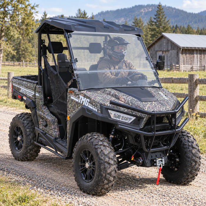 UTV / Côte à Côte de 585 cm³ avec 4x4 à la demande, EPS, transmission CVTech, 2 sièges avec appuie-tête, différentiels autobloquants et attelage de remorque TMG-ATU765