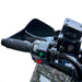 Left handlebar controls, switches, and handguard visible on ATV