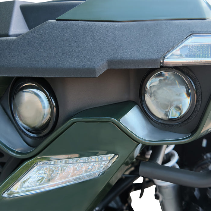 Front headlight assembly and lower signal light detail on ATV.