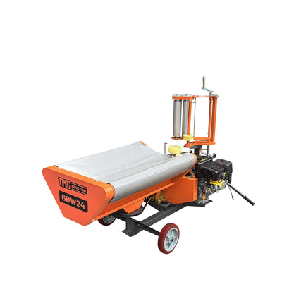 Orange TMG Industrial bale wrapper angled view showing conveyor, engine, wheels