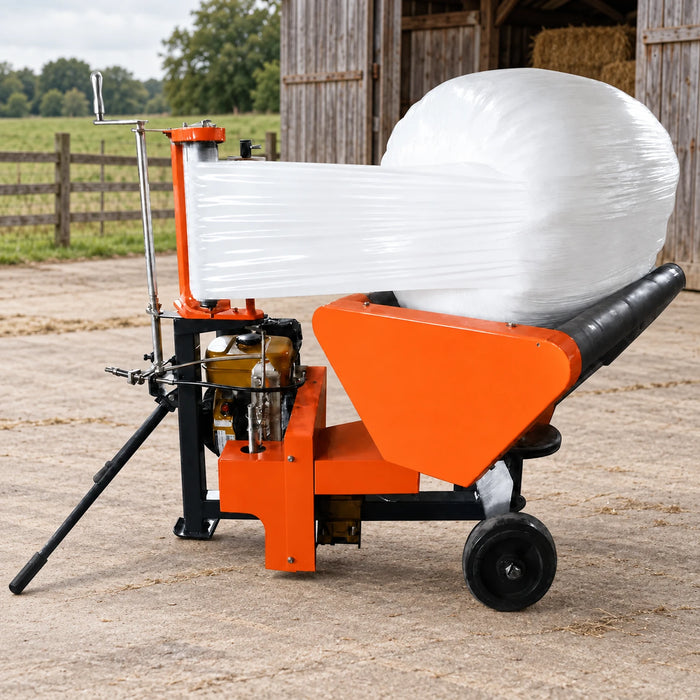 Outdoor TMG Industrial bale wrapper wrapping a round bale with stretched film