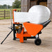 Outdoor TMG Industrial bale wrapper wrapping a round bale with stretched film