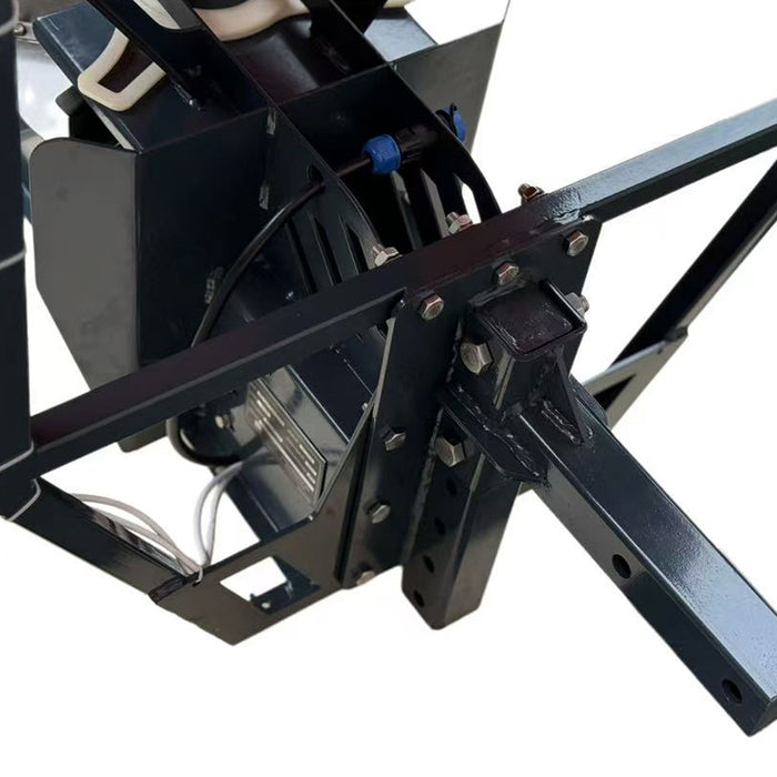 Close-up of the TMG-TSS300 salt spreader receiver hitch connection, mounting bolts, electric motor and wiring beneath the hopper.